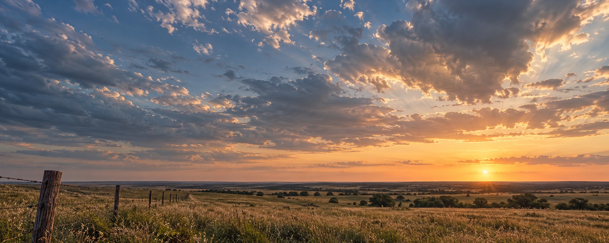 AI-generated Texas prairie at sunset under a wide partly cloudy sky, with a weathered fence